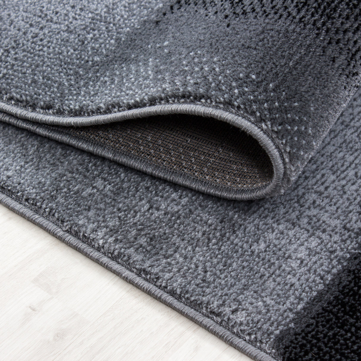 Kristal 9250 Schwarz – Moderner Uni Teppich mit zeitlosem Design