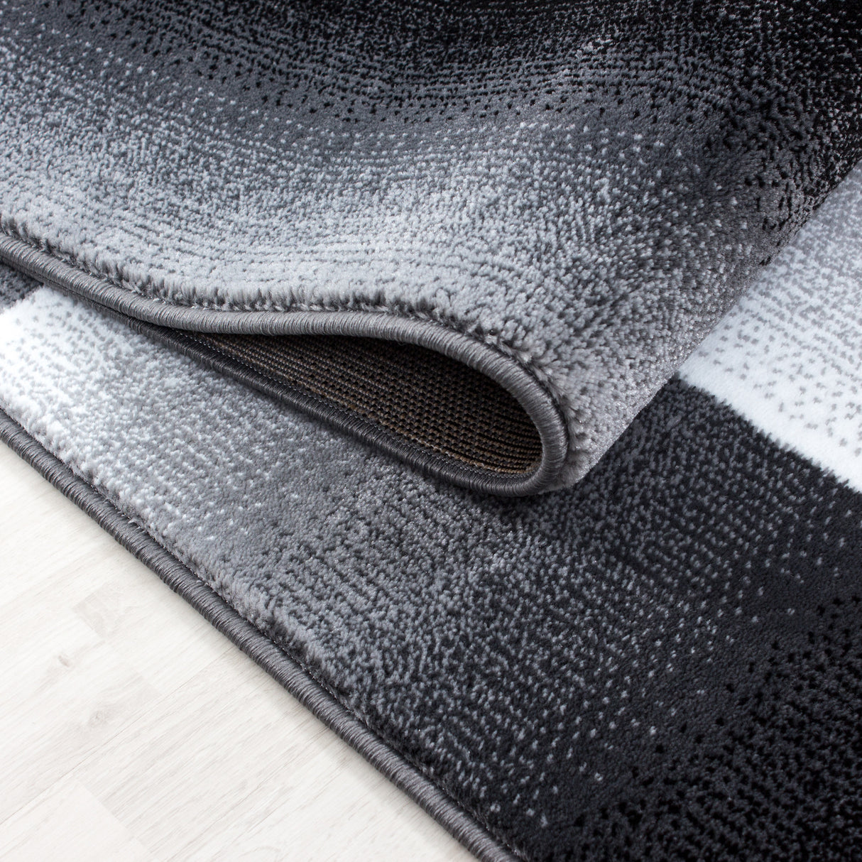 Carisma 6560 Schwarz – Moderner Uni Teppich mit zeitlosem Design